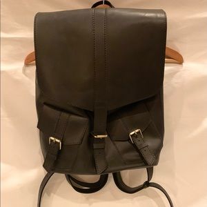 Handmade black leather backpack with suede lining